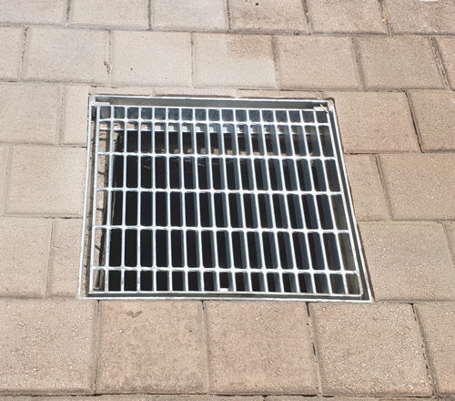 New soakwell grate over old cover.