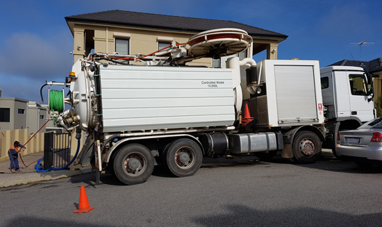 Removing contaminated waste from soakwells around Perth.